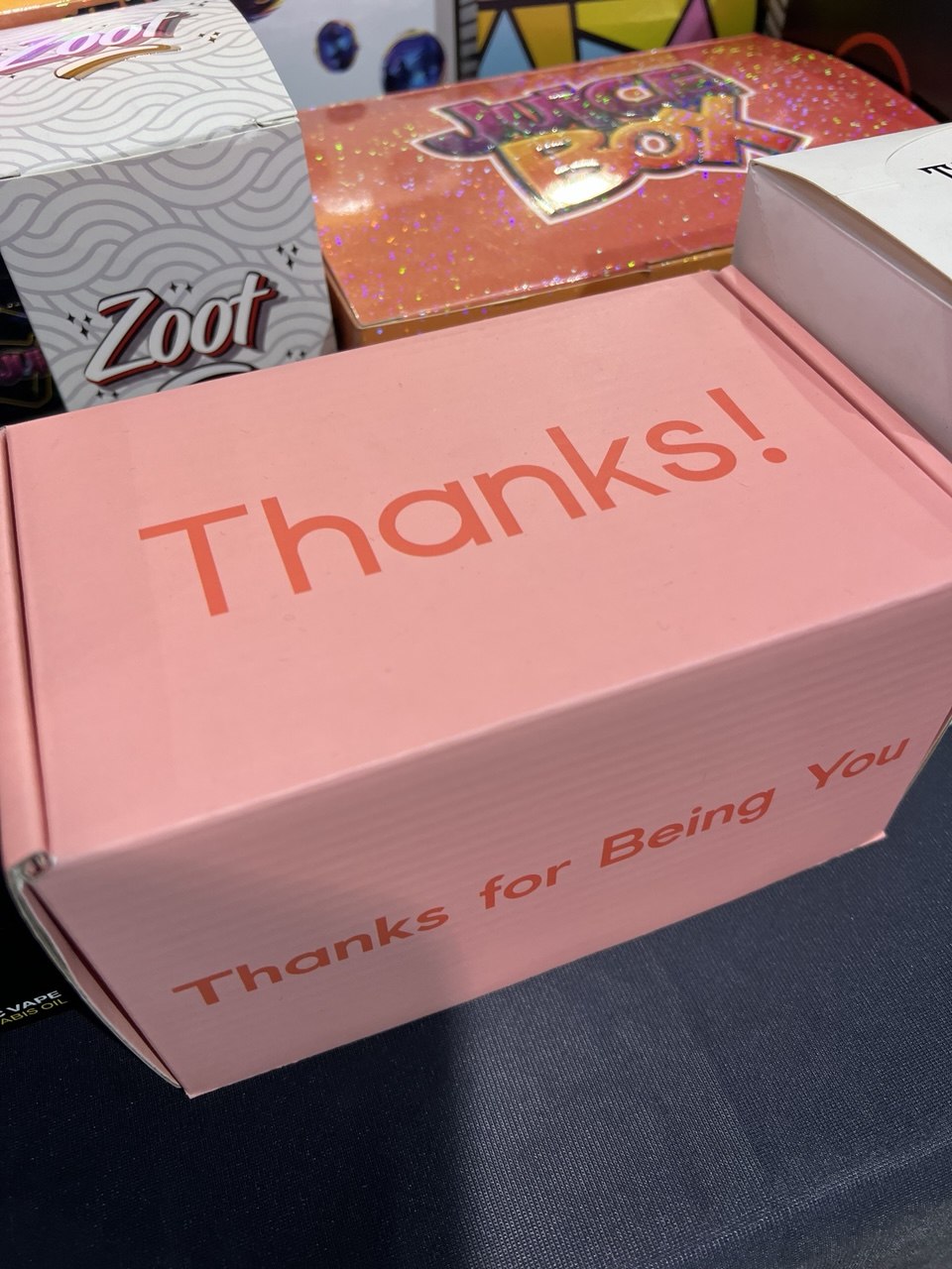 Custom packaging samples including mailer boxes, holographic boxes, and branded packaging by Package R US